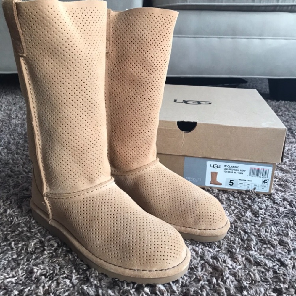 Never worn tall Ugg boots